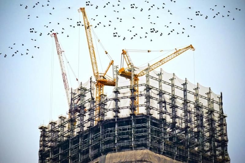 Cranes over a building under construction